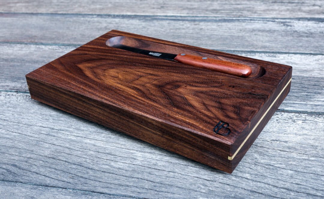 Serving Trays in walnut with brass inlay, carved bowl and brass feet