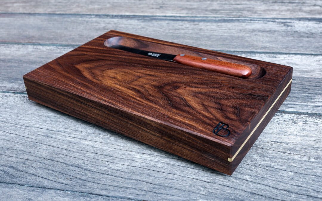 Serving Trays in walnut with brass inlay, carved bowl and brass feet